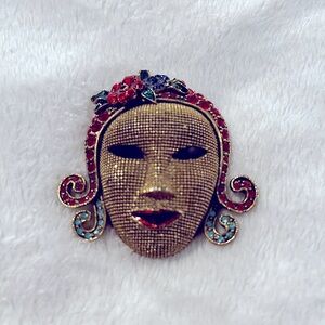 Vintages gold tone Josephine Baker face mask brooch.
